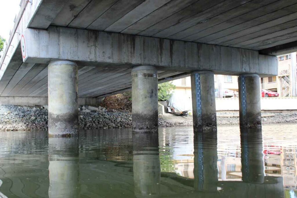 Concrete pile encapsulation repair for bridges